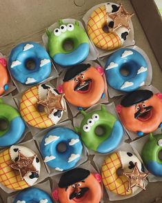 there are many donuts with different characters on them in the box, and one is decorated like an angry bird