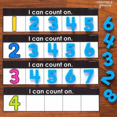 three blue numbers and one black number are on top of a wooden table with the words i can count on