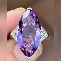 8.55ct Marquise Brazilian Amethyst With .11ctw White Zircon Rhodium Over Sterling Silver Ring. .72"L X .93"W. Finished Under Gallery. Accent Stones Primarily Zircon. Ring Attributes: Metal Weight2.61 G Band Width0.07 In Material Sterling Silver Finish Rhodium Primary Stone Amethyst Gemstone & Info If You Are Fortunate Enough To Be Born In February, Amethyst Is Your Birthstone. This Wonderful Member Of The Quartz Family Often Forms Large, Six-Sided Crystals. It's Usually Quite Clear And Can Be Cut Into Almost Every Shape, Which Makes It Ideal For Jewelry. Because Amethyst Is A 7 On The Mohs Scale Of Hardness, It's Very Wearable. Versatile Amethyst Offers A Wide Variety Of Shades, From Reddis Luxury Sterling Silver Gemstones With Diamond Accents, Formal Sterling Silver Gemstones With Diamond Accents, Elegant Amethyst Gemstones With Diamond Accents, Formal Amethyst Gemstones With Gemstone Accents, Formal Amethyst Gemstones With Accents, 14k White Gold Purple Gemstone Jewelry, 14k White Gold Gemstones, Purple Gemstone Jewelry In 14k White Gold, Purple Amethyst Gemstones With Diamond Accents