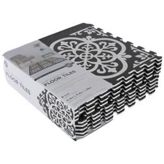 a stack of black and white paper with an intricate design on the bottom, in front of a white background