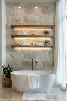 15 Tips for Installing Bathroom Floating ShelvesEveryday Inspo Floating Shelves Master Bath, Floating Shelves Bathroom Storage, Shelves Above Bathtub, Shelving In Bathroom, Bathroom Floating Shelves, Bath Shelves, Bathroom Main, Bathtub Shelf, Floating Shelves Bedroom