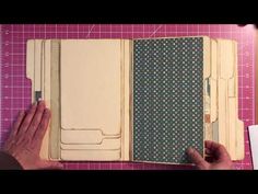 someone is making a book out of scrapbook paper