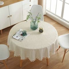 a white table and chairs in a room