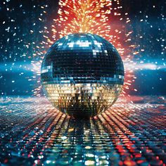 a shiny disco ball with fireworks in the background