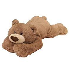 a brown teddy bear laying on its side