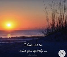 the sun is setting over the ocean with a message written on it that reads, i learned to miss you quietly