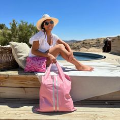 Pretty in Pink! Our Carryall Tote made bigger for the Beach! Saunter through summer with this fairy pink tote that reflects our love of the resort island life. Hi Love reimagined the classic solid pack with contrasting vertical stripes in silver. HI LOVE Insider: Unfold at a moment’s notice for a perfectly chic carryall tote for shopping, the grocery, or days on the beach. Functional, lightweight, and versatile fashion Featuring an interior zipper pocket for added organization Large enough in si Poolside Tote Beach Bag, Summer Pink Bags For Poolside, Pink Summer Beach Bag For Poolside, Casual Pink Beach Bag For Poolside, Casual Pink Poolside Bag, Pink Summer Beach Bag For Vacation, Pink Beach Bag For Vacation, Summer Pink Beach Bag For Vacation, Casual Pink Beach Bag For Vacation