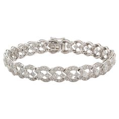 We are pleased to present this stunning 18k White Gold & Diamond Contemporary Art Deco Bracelet. It features an estimated 2.75ctw H-I/SI1-SI2 round brilliant cut diamonds all securely set in this breathtaking 18k white gold contemporary art deco inspired bracelet with push button and safety clasp. The bracelet will fit a wrist up to 7″ wrist. It is in excellent condition with very few signs of wear. This is a truly stunning piece! Please feel free to message us with any questions, we’re happy to help! Contemporary Art Deco, Art Deco Bracelet, Art Deco Stil, Art Deco Inspired, Inspiration Art, Round Brilliant Cut Diamond, Push Button, White Gold Diamonds, Round Brilliant