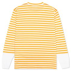 Make an impression on your next outfit with the Comme des Garçons PLAY Women’s Striped White Sleeve L/S T-Shirt. This cotton-cut design sports a subtle crew neckline along with contrasting sleeves. An embroidered heart at the chest finishes the look. 100% cotton Crew neckline Striped pattern Embroidered motif Style No: AZ-T319-051-2 Yellow Tops With Ribbed Cuffs For Streetwear, Yellow Cotton Tops With Ribbed Cuffs, White T-shirt With Ribbed Cuffs For Spring, Yellow Crew Neck Top With Graphic Print, Spring Crew Neck T-shirt With Contrast Stripes, Sporty Striped Crew Neck Top, Cotton Tops With Contrast Stripes And Crew Neck, Sporty Striped Top With Ribbed Cuffs, Sporty Tops With Ribbed Neckline For Streetwear