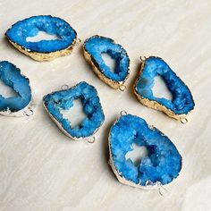 Listing is for one (1) Large Mystic Aqua Blue Druzy Quartz Geode Raw Drusy Agate Slice Double Bail Connector Pendant with Electroplated Silver, Gold plated STOCK PHOTO-- Pendants will vary in size and color. Shape : Slab Connector Choose your quantities from the drop down menu Pendant Measures approx. : 33-43mm x 47-55mm (including bails) -- sizes will vary slightly for each pendant. Blue Agate Round Jewelry, Adjustable Blue Agate Necklace, Handmade Blue Agate Earrings, Turquoise Agate Round Beads Gems And Cabochons, Quartz Geode, Handmade Turquoise Agate Beads, Gems, And Cabochons, Druzy Quartz, Photo Pendant, Agate Slice