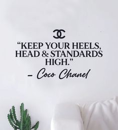 a wall decal that says keep your heels, head and standards high coco chanel