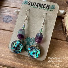 Abalone earrings shell jewelry flourite gemstone silver bohemian beach purple earrings dangle boho crystal unique jewelry earrings for women Drop length: 1.5 inches These beach beauties have 14mm abalone shell beads, 12mm fluorite gemstone beads, 4mm Swarovski crystal beads, silver plated findings and ear wires. Unique boho earrings from SLDbeadwork. Earrings for women. Yes, please. I love to rock a great pair of earrings. Stone, crystal, lampwork, beaded earrings, well I love all of them Can't Purple Dangle Jewelry For Beach, Purple Dangle Earrings For Beach, Purple Dangle Earrings For The Beach, Handmade Purple Beach Jewelry, Purple Bohemian Earrings For Beach, Purple Drop Earrings For The Beach, Purple Drop Earrings For Beach, Purple Earrings For Summer Beach, Purple Bohemian Jewelry For Summer