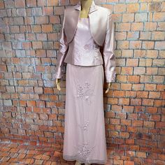 Jovani Blush Pink Skirt Set With Jacket Cropped Jacket Has Embroidered Collar, Padded Shoulders And Long Sleeves With Embroidered Beaded Cuffs Camisole Has Back Zipper Tulle Covered Maxi Skirt Has Back Zipper With Hook-And-Bar Closure All Pieces Fully Lined, 75% Silk / 25% Wool And Are Size 6 Jacket Measures 18” Armpit To Armpit And 14.5” Long Top Measures 16” Armpit To Armpit And 19” Long Skirt Measures 13.5” Side To Side At Waist And 40” Long Excellent Preowned Condition! Perfect For Mother-Of Elegant Pink Outerwear For Festive Occasions, Elegant Pink Festive Outerwear, Blush Pink Skirt, Pink Skirt Set, Formal Skirt, Embroidered Collars, Beaded Cuff, Pink Skirt, Floral Chiffon