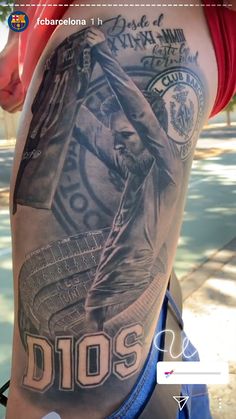 the back of a man's leg with tattoos on it and an image of a baseball player