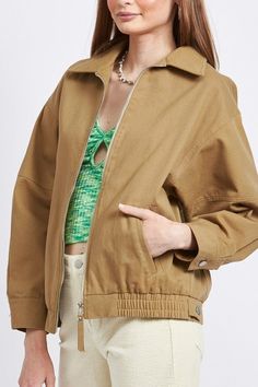 Elevate your casual-chic wardrobe with our Khaki Oversized Bomber Jacket. This versatile piece combines classic military-inspired style with modern comfort, perfect for the fashion-forward woman. The relaxed, oversized fit offers a trendy silhouette while providing ample room for layering. Key Features: Soft, durable 100% cotton outer shell Smooth 100% polyester lining for easy wear Ribbed collar, cuffs, and hem for a snug fit Front zip closure with storm flap for added protection Two side pocke Short Cardigan Sweater, Cotton Twill Jacket, Suede Outfit, Shawl Sweater, Cardigan Sweater Coat, Twill Jacket, Denim Accessories, Collars For Women, Oversized Jacket