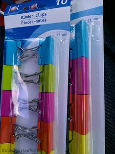 three binders with clips on them are in the package for sale at a store