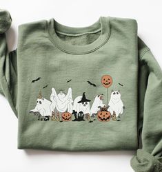 CHRISTMAS DEADLINE: We can no longer guarantee shipment by Christmas. Sorry :(  These unisex cozy sweatshirts (we use Gildan) are printed with a cute Halloween themed raccoons in ghost costume graphic 😀 * 50% cotton, 50% polyester * Pre-shrunk * Classic fit * 1x1 athletic rib knit collar with spandex * Air-jet spun yarn with a soft feel and reduced pilling * Double-needle stitched collar, shoulders, armholes, cuffs, and hem SIZING: Please ensure you check measurement chart before ordering as sh Cute Cartoon Print Sweatshirt For Fall, Cute Halloween Sweatshirt With Letter Print, Green Cartoon Print Sweatshirt For Fall, Novelty Long Sleeve Sweatshirt, Cute Cartoon Print Fall Sweatshirt, Funny Print Sweatshirt For Fall, Cute Fall Sweatshirt With Character Print, Halloween Crew Neck Sweatshirt For Loungewear, Halloween Cotton Sweatshirt For Loungewear