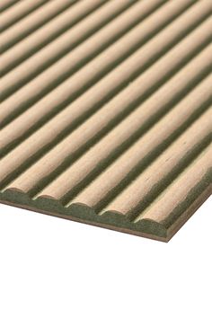 a beige and green rug with vertical stripes on it's sides, in front of a white background