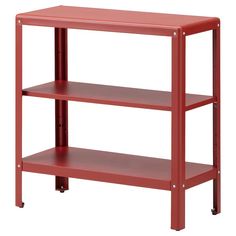 a red shelf sitting on top of a white wall