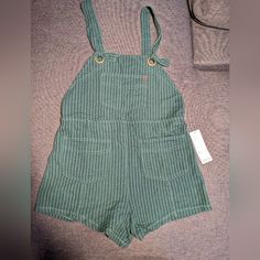 Shorts Jumper Color Green Size Medium Green Overalls For Work, Green Workwear Overalls, Casual Green Shortalls With Pockets, Green Summer Shortalls Overalls, Green Cotton Overalls, Green Relaxed Fit Bottoms From Urban Outfitters, Urban Outfitters Relaxed Fit Green Bottoms, Fitted Green Overalls With Pockets, Green Bottoms With Pockets From Urban Outfitters