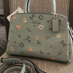 Coach Mini Lillie Carryall With Mystical Floral Print. Nwt Comes With Adjustable Crossbody Strap Handles With 4 1/4" Drop Outside Open Pocket Detachable Strap With 21 1/2" Drop For Shoulder Or Crossbody Wear Four Protective Feet At Base 10 1/4" (L) X 6 3/4" (H) X 4 1/4" (W) Floral Coach Bag, Elegant Coach Bags With Floral Print, Coach Floral Print Bags For Everyday Use, Light Blue Crossbody Bag For Spring, Elegant Blue Bags With Floral Print, Chic Blue Floral Print Bag, Spring Coach Top Handle Bag, Coach Top Handle Bag For Spring, Coach Spring Satchel Bag