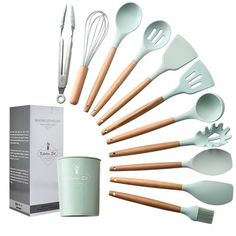 an assortment of kitchen utensils in front of a box