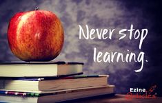 an apple sitting on top of a stack of books next to a chalkboard with writing mentor texts