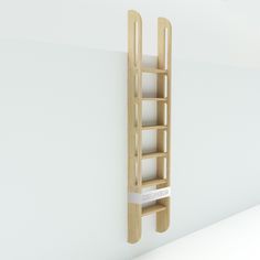 there is a wooden ladder hanging on the wall next to a white wall with an empty shelf below it