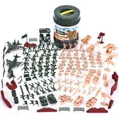 an assortment of toy army figures and accessories on a white background with a jar of paint