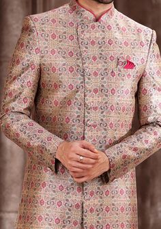 Ready-Made Sherwani With Trouser. All Over Jacquard Brocade Style Printed Fabric Top. Art Dupion Aligarhi Ready Made Trouser. Crafted in Chinese Collar Neck, and Full Sleeve. Satin Lining with Plain Work. High-Quality Matching Buttons. Please Note: The footwear shown in the picture is for presentation and photography purpose only. Color: There might be slight color variation due to lightings and flashes while photo shooting. The color may also vary because of different screen resolutions. Wash C Fitted Bandhgala For Festive Occasions Like Diwali, Semi-stitched Brocade Sets With Zari Work, Festive Suits With Zari Work Unstitched, Bandhgala With Resham Embroidery In Jamawar For Festivals, Transitional Brocade Sets With Dupatta, Transitional Season Brocade Sets With Dupatta, Festive Fitted Motifs Sets, Festive Fitted Sets With Motifs, Elegant Unstitched Multicolor Kurta