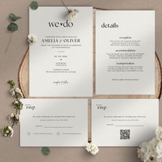 the wedding stationery is laid out on a table with flowers and greenery around it