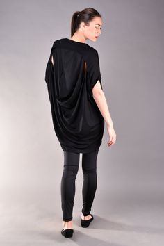 "Black Top, Womens Blouse, Plus Size Clothing, Casual Top. Modern hip length top in black. This short sleeve top is oversized and has very loose fit cut which hides the imperfections and makes you feel comfortable and beautiful at the same time. The plus size top features so trendy cut out back with draped style. Match it with black leggings and add a colour popping handbag to finish the look. ^ Sizes: The item can be made in sizes from XXS to 7XL. Please, use the size chart below or if you are Black Short Sleeve Lagenlook Top, Versatile Oversized Black Tops, Oversized Black Casual Tunic, Versatile Black Batwing Sleeve Tops, Oversized Black Top For Layering, Black Batwing Sleeve Tops For Layering, Slouchy Black Tops For Layering, Black Slouchy Tops For Layering, Oversized Black Chic Tunic