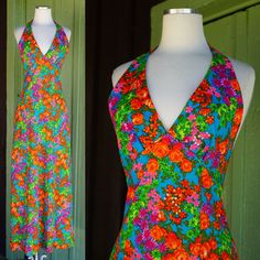 Gorgeous Dress Circa 1970s My estimate is that the fabric is 1970s and the dress may have been made a bit later Vibrant Floral Print in Orange, Pink, Purple, Green with Teal Background Halter Neckline with Hook & Eye to Secure  Open Back V Neckline Gathers Slightly at Bust Peaked Empire Waistline Maxi Length Center Back Zip - Appears to be a more modern hidden style zip **stitching down front left seam shows. bottom hem is hand stitched and slightly inconsistent with different thread colors and stitch styles. not obvious since it is the hem, but please see all photos. dress sold as is No Tags Tag size may not be accurate to current day sizing, please refer to garment's measurements. Garments are measured laying flat - measurements doubled as necessary. Front Bust: 14.5 in (not doubled sinc Retro V-neck Lined Maxi Dress, Vintage Summer Maxi Dress With Retro Print, Fitted Retro Print Maxi Dress, 1970s Fitted Multicolor Maxi Dress, 1970s Style Fitted Multicolor Maxi Dress, Retro Lined Maxi Dress, 1970s Style Multicolor Maxi Dress, 70s Inspired Fitted Summer Maxi Dress, Fitted 70s Inspired Summer Maxi Dress