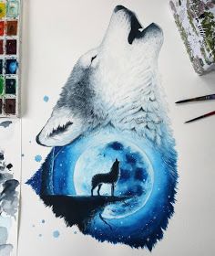 a wolf painting on paper with paintbrushes next to it