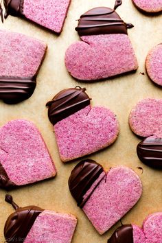 pink heart shaped cookies with chocolate on top