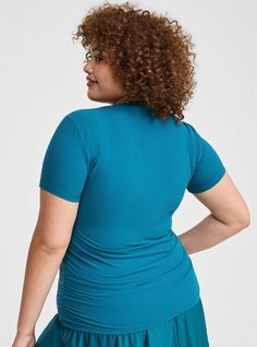 FIT Model is 5'10. 5” wearing size 1. . Measures 28” from shoudler (size 2). MATERIALS + CARE Performance Core Rib knit fabric: All the smoothing lift of our Performance Core fabric, now in a ribbed texture with a flexible feel. Stretch level: Maximum 4-way stretch so you can move without restrictions. Breathable to keep you cool. Maximum coverage and never see-through. Moisture wicking keeps you dry. Smoothing tech delivers light compression. 74% nylon, 26% spandex. Machine wash cold. Tumble dr Fitted Seamless Blue Top, Seamless Tops With Relaxed Fit, Solid Color Seamless Tops With Relaxed Fit, Versatile Blue Crew Neck Top, Versatile Seamless Short Sleeve Tops, Blue Ruched Short Sleeve Top, Versatile Fitted Blue Top, Fitted Versatile Blue Tops, Blue Stretch Seamless Tops