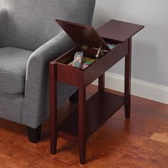 a chair with a tray on top of it next to a table that has snacks in it