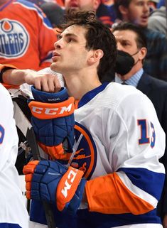 the edmonton oilers'goalie looks on from the bench