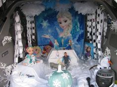 the back of a car decorated with frozen princesses and snowflakes on display