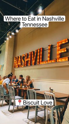 people sitting at tables in front of a sign that says nashville, where to eat in nashville