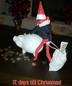 an elf riding on top of a piggy bank with money coming out of it