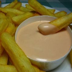 french fries with dipping sauce in a white bowl