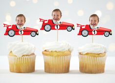 two cupcakes with cars on them and one is topped with white frosting