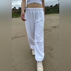 Thick And Cozy Cotton Blend Sweatpants With An Elastic Waistband, Side Pockets, And Elastic Cuffs. Fabrics: 82% Cotton, 18% Polyester Measurements: 10" (25 Cm) Rise, 27" (69 Cm) Inseam, 24" (61 Cm) Waist (Stretches) Made In: China Casual White Wide Leg Joggers, Casual White Wide-leg Joggers, White Full-length Leisure Pants, White Full-length Cotton Joggers, White Fitted Leisure Bottoms, White Full Length Cotton Joggers, White Cotton Full Length Joggers, White Relaxed Fit Trendy Joggers, Casual White Pants With Ribbed Waistband