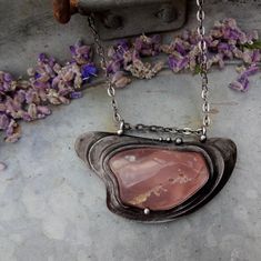 The handmade necklace is made of tin, amethyste and rose quartz. - 40 mm x 70 mm.  - 18 + inches metal chain.