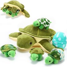 several stuffed animals that are laying on top of each other in the shape of turtles