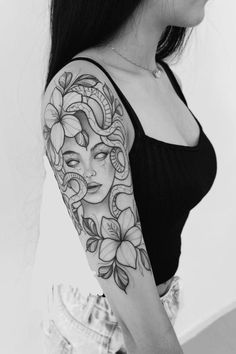 a woman with a tattoo on her arm