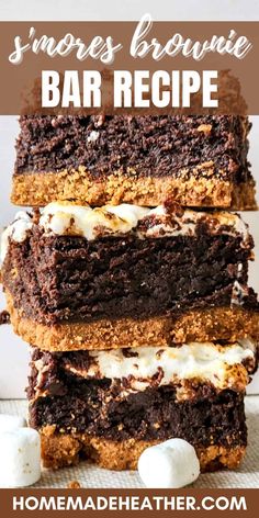 three brownie bars stacked on top of each other with marshmallows in the middle