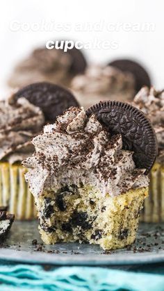 an oreo cookie cupcake on a plate with one bite taken out of it