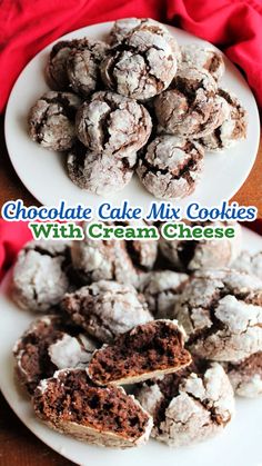 chocolate cake mix cookies with cream cheese on a white plate next to red napkins